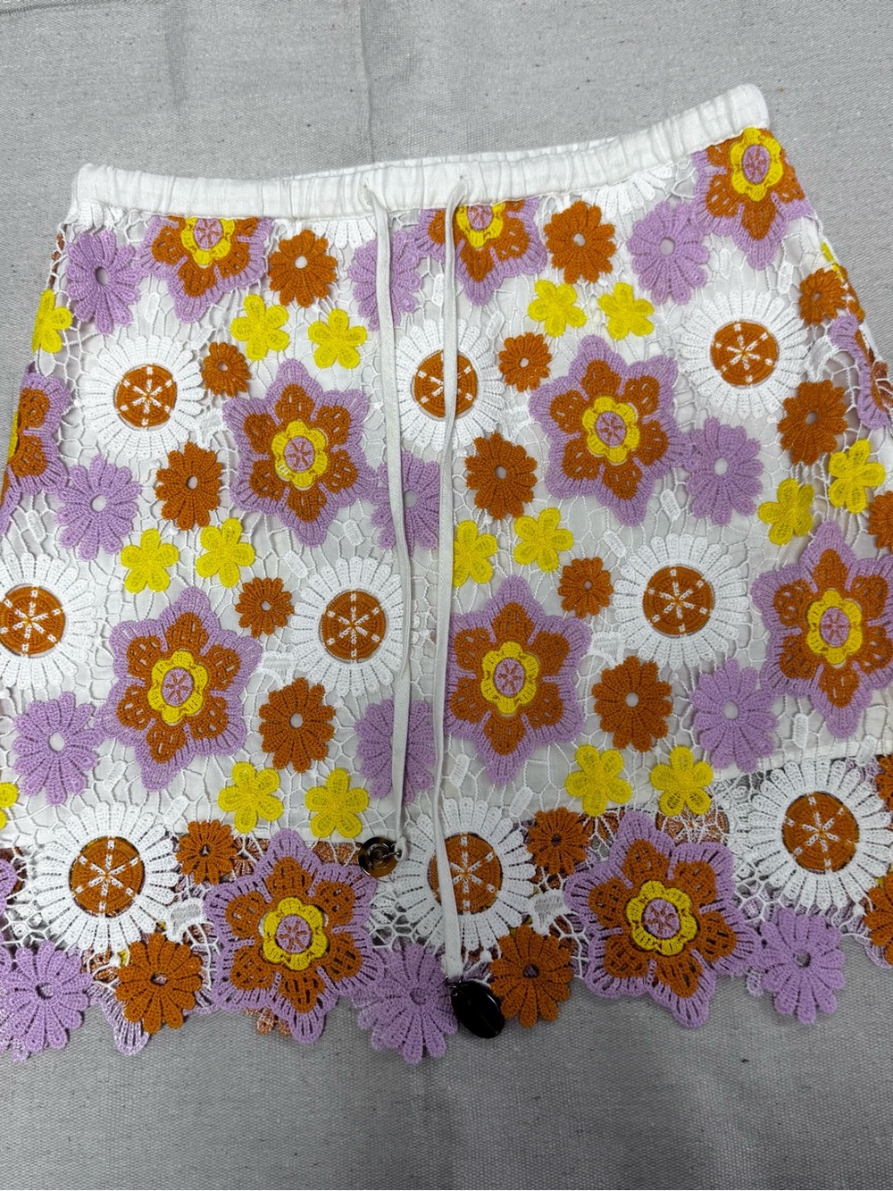 Zara floral crochet mini skirt worn by Enid Sinclair size small